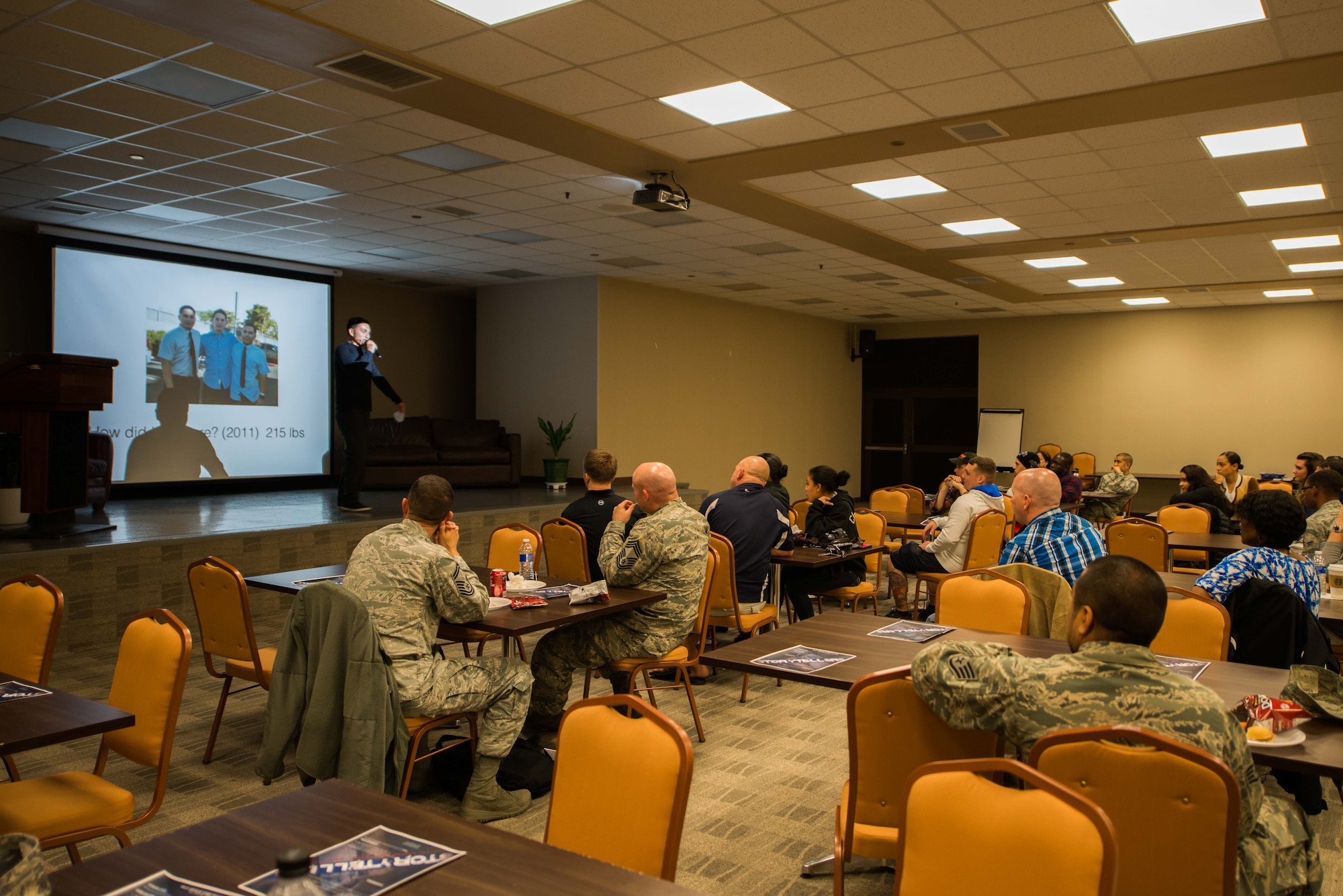 U.S. Air Force Master Sgt. Humberto Conchas, 5th Reconnaissance Squadron aircraft section chief, speaks during an Osan Storytellers event at the Mustang Resiliency Center at Osan Air Base, Republic of Korea, Oct. 26, 2016. Conchas shared with the audience his story of past weight gain and how it affected his job performance four years ago. Osan Storytellers is a quarterly event giving Airmen of all ranks the opportunity to share personal and military experience with other Airmen. (U.S. Air Force photo by Senior Airman Dillian Bamman)