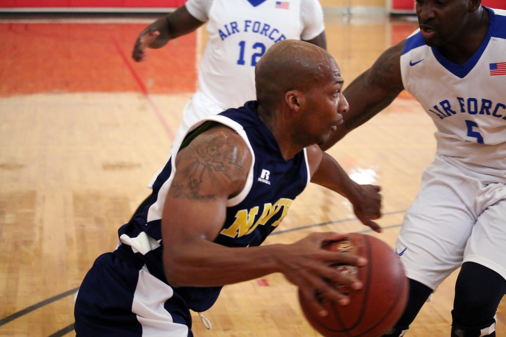 All-Navy's Derrick Sumpter of the U.S. Coast Guard scores 26 against Air Force, but Air Force holds on to the lead to win 79-72.  The 2016 Armed Forces Men's Basketball Championship held at MCB Quantico, Va. from 1-7 November.  The best two teams during the doubel round robin will face each other for the 2016 Armed Forces crown.  