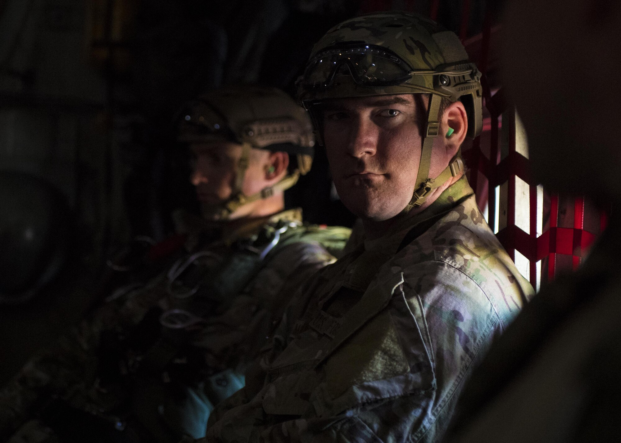 374th Operations Support Squadron survival, evasion, resistance and escape specialists wait to perform a high altitude low opening parachute jump out of a C-130 Hercules on 26 Oct. 2016, at Yokota Air Base, Japan. The SERE specialists are trained for contingency situations, such as evading and escaping capture behind enemy lines. (U.S. Air Force photo by Airman 1st Class Donald Hudson/Released)