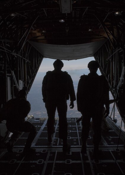 374th Operations Support Squadron survival, evasion, resistance and escape specialists prepare for a high altitude low opening jump out of a C-130 Hercules on 26 Oct. 2016, at Yokota Air Base, Japan. The SERE specialists are trained for contingency situations, such as evading and escaping capture behind enemy lines. (U.S. Air Force photo by Airman 1st Class Donald Hudson/Released)