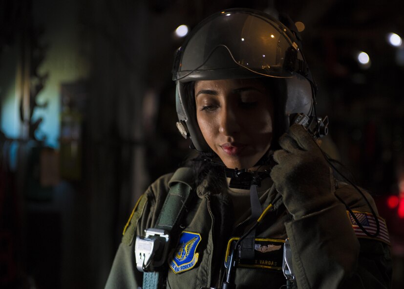 Airman 1st Class Alexandra N. Vargas, 36th Airlift Squadron C-130 Hercules loadmaster listens to pilot instructions during a personnel drop training exercise on 26 Oct. 2016, at Yokota Air Base, Japan. The training not only allowed the survival, evasion, resistance and escape personnel to practice jumping, it helped loadmasters and other aircrew members perform personnel drop training. (U.S. Air Force photo by Airman 1st Class Donald Hudson/Released)