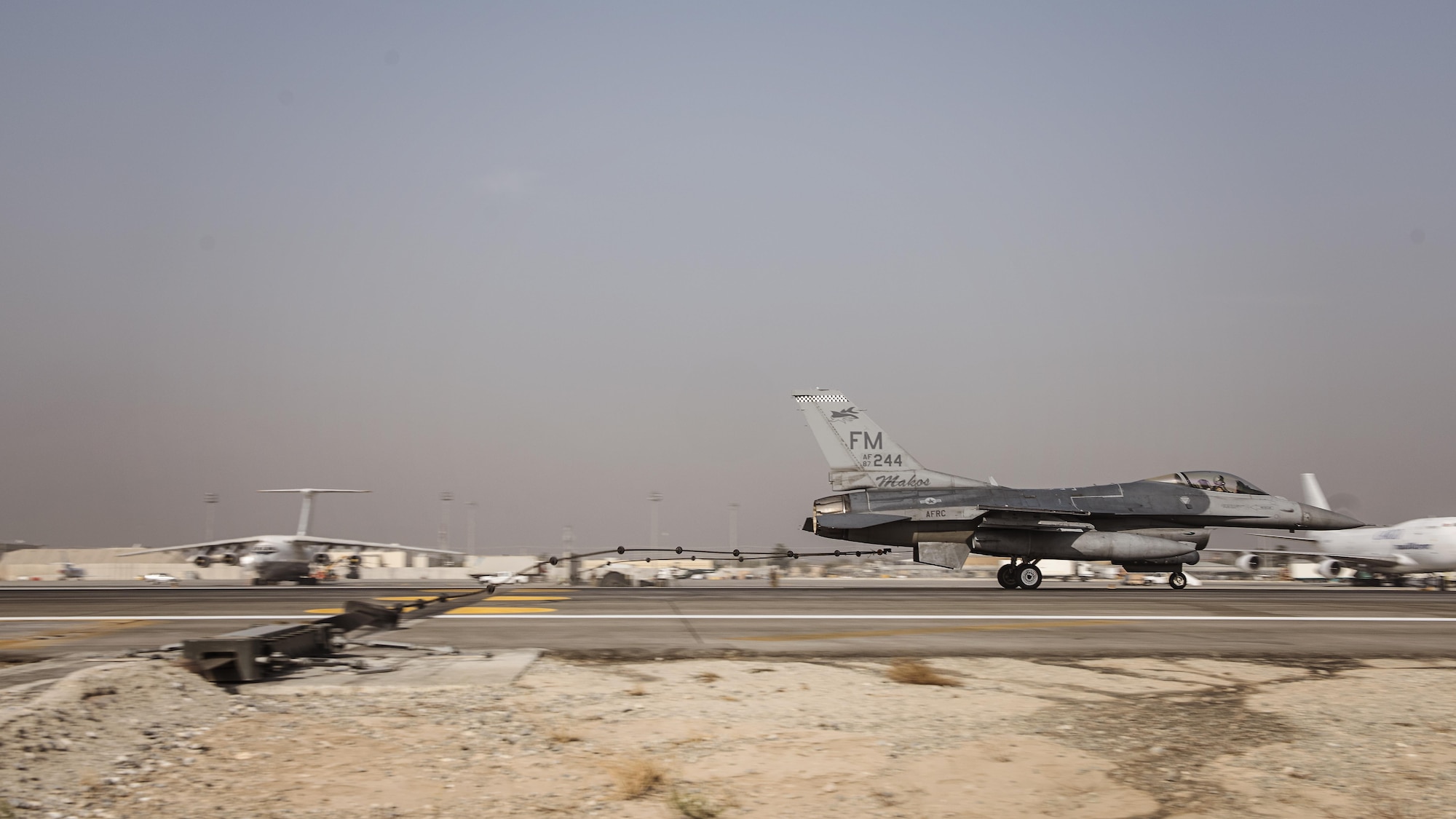 An F-16 Fighting Falcon belonging to the 93rd Expeditionary Fighter Squadron engages a barrier during a certification test of the Mobile Aircraft Arresting System Oct. 30, 2016 at Bagram Airfield, Afghanistan. Testing of the MAAS is required annually when a real-world barrier engagement has not taken place. (U.S. Air Force photo by Staff Sgt. Katherine Spessa)