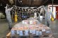 Staff Sgt. Richard Allen, a 731st Air Mobility Squadron special planning supervisor, and Airman 1st Class Kevin Johnston, a 731st AMS special planning technician, toss a securing net over an ammunitions shipping build during routine operations at Osan Air Base, South Korea, Nov. 2, 2016. The special handlers provide storage and shipping requirements for critical military items across the Korean Peninsula. (U.S. Air Force photo/Senior Airman Dillian Bamman)