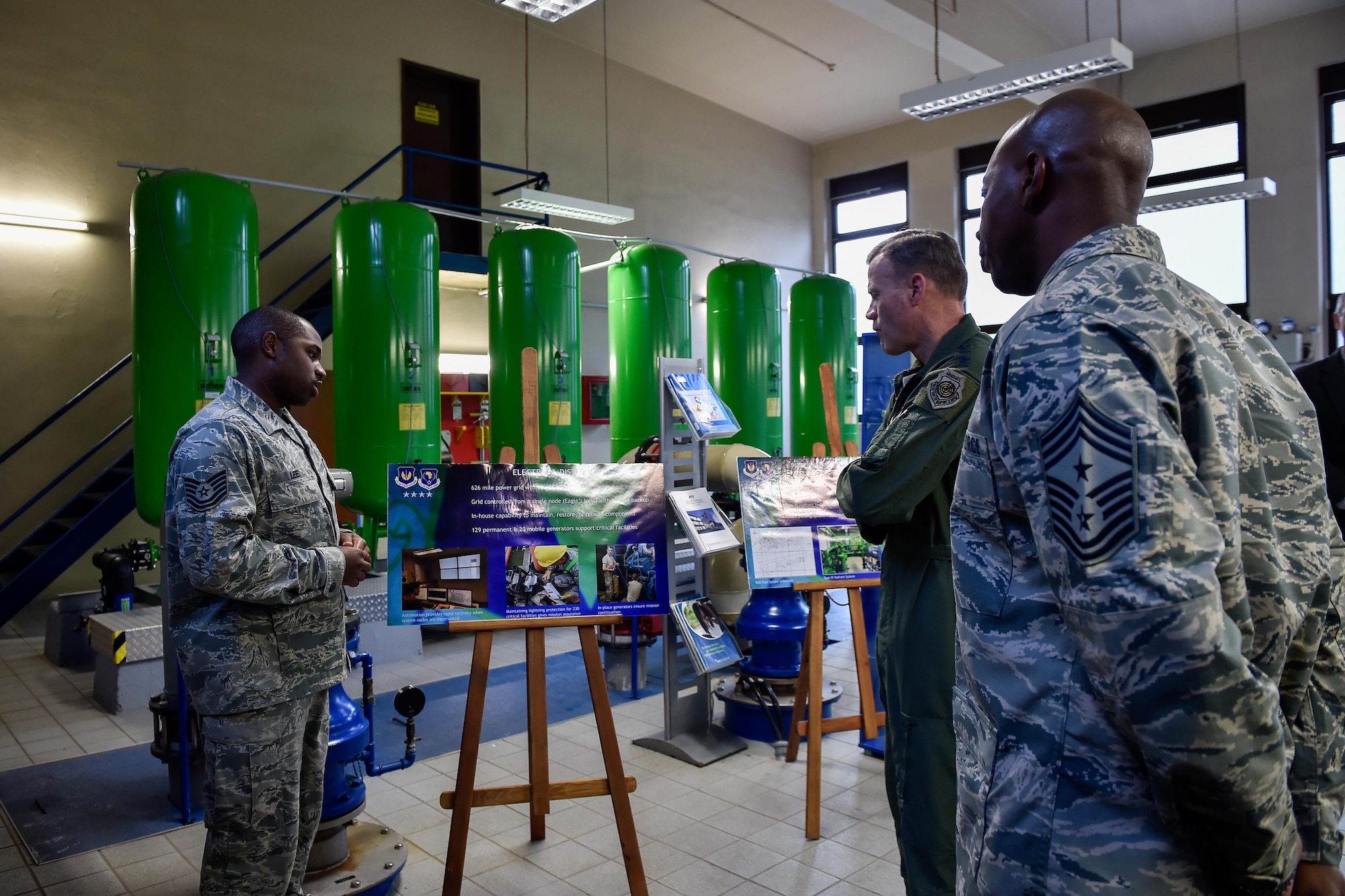 Tech. Sgt. Brian Lee, 786th Civil Engineer Squadron electrical systems section chief, briefs Gen. Tod Wolters, U.S. Air Forces in Europe and Air Forces Africa, and Chief Master Sgt. Kaleth Wright, USAFE-AFAFRICA command chief, during a tour of the 86th Airlift Wing at Ramstein Air Base, Germany, Nov. 1, 2016. The electrical systems section is in charge of 129 permanent and 20 mobile generators supporting critical base facilities. (U.S. Air Force photo by Senior Airman Nicole Keim)