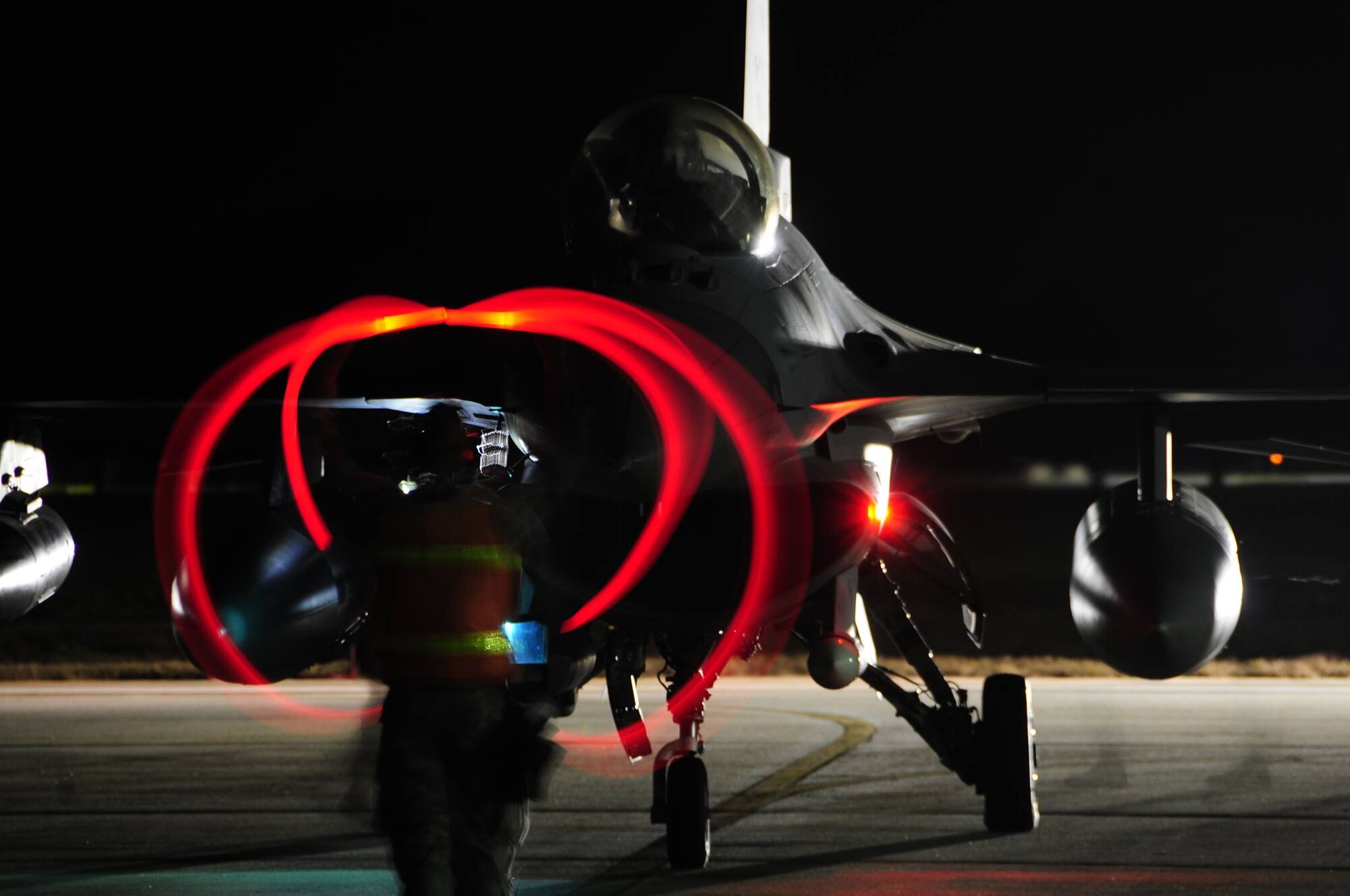 A U.S. Airman marshals an F-16CM Fighting Falcon at Shaw Air Force Base, S.C., Oct. 26, 2016. Airmen and F-16s assigned to the 79th Fighter Squadron deployed to Bagram Airfield, Afghanistan in support of Operation Freedom’s Sentinel. (U.S. Air Force photo by Lt. Col. Michael Horlbeck)