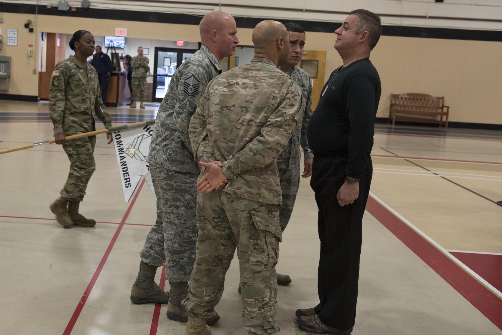 Former drill sergeants and military training instructors give Douglas Torterelli, an honorary commander, a quick lesson on military bearing at the Honorary Commander Boot Camp on Joint Base McGuire-Dix-Lakehurst, New Jersey, Oct. 27, 2016. The mock basic military training is designed to give local community leaders insight into the training performed here and the life service members lead. 