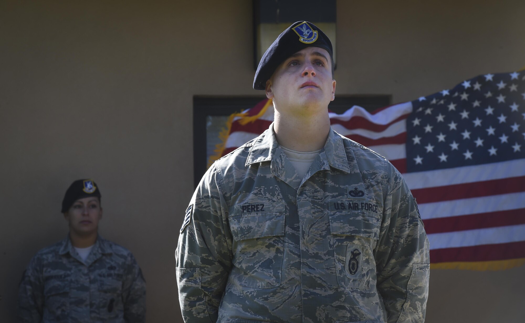 Staff Sgt. Yessiell Perez, 11th Security Forces Squadron military working dog handler, stands at parade rest during a memorial service at Joint Base Andrews, Md., Oct. 28, 2016. The service honored the MWD’s accomplishments and included a 21-gun salute and the playing of Taps. (U.S. Air Force photo by Senior Airman Mariah Haddenham)