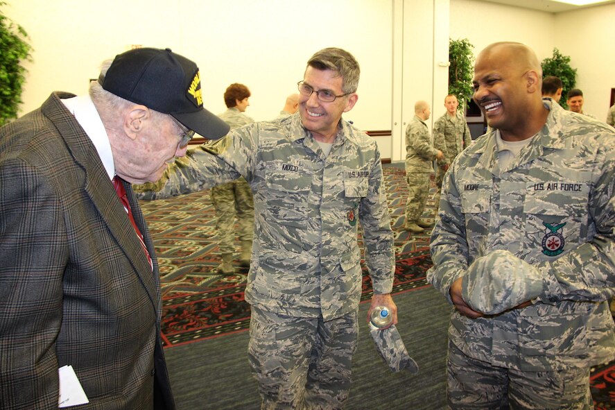 Airmen of the 932nd Civil Engineering Squadron, 932nd Airlift Wing, welcome a World War II veteran to a unit event earlier in the year.  This year's special Veteran's Day is coming up on Friday, November 11.  (U.S. Air Force photo by Lt. Col. Stan Paregien)