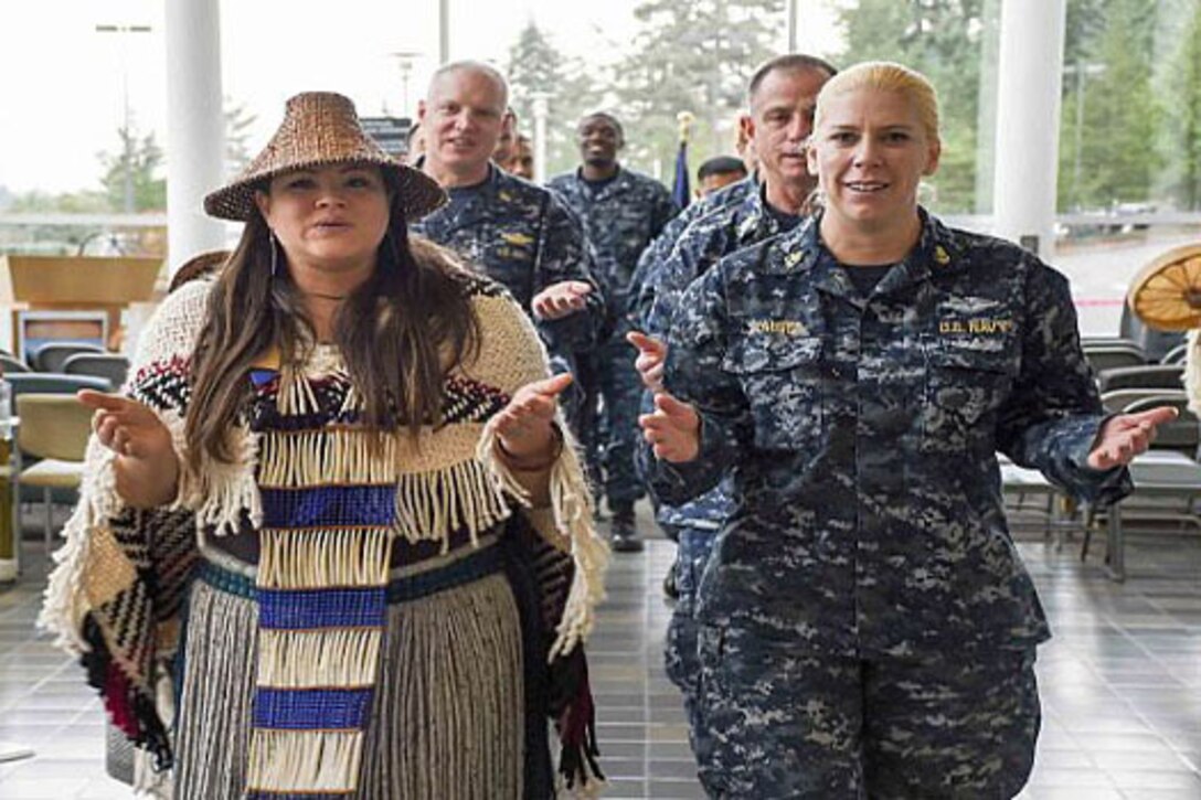 Staff members perform a traditional tribal dance at Naval Hospital Bremerton for a Native American heritage ceremony in honor of National American Indian Heritage Month. Navy photo by Petty Officer 3rd Class Shauna C. Sowers