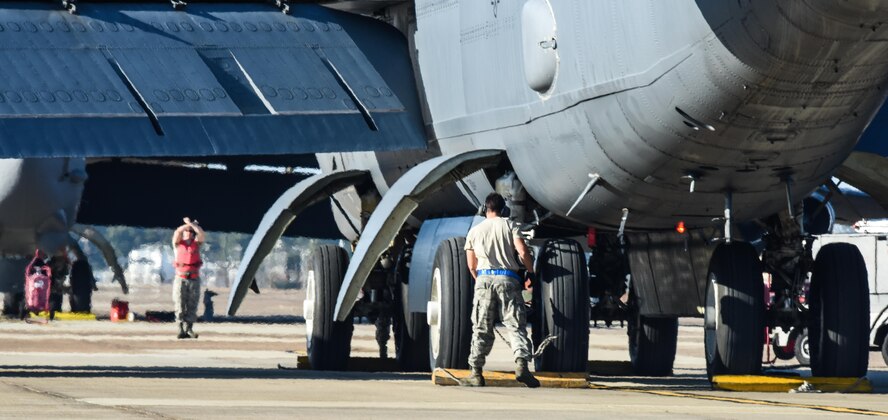 Maintenance Airmen help park a B-52 Stratofortress at Barksdale Air Force Base, La., Oct. 30, 2016. The aircraft had returned after supporting U.S. Strategic Command exercise Global Thunder 17. USSTRATCOM forces are on watch 24-hours-a-day, 7-days-a-week, conducting operations to deter and detect strategic attack against the U.S. and its allies. (U.S. Air Force photo/Senior Airman Luke Hill)