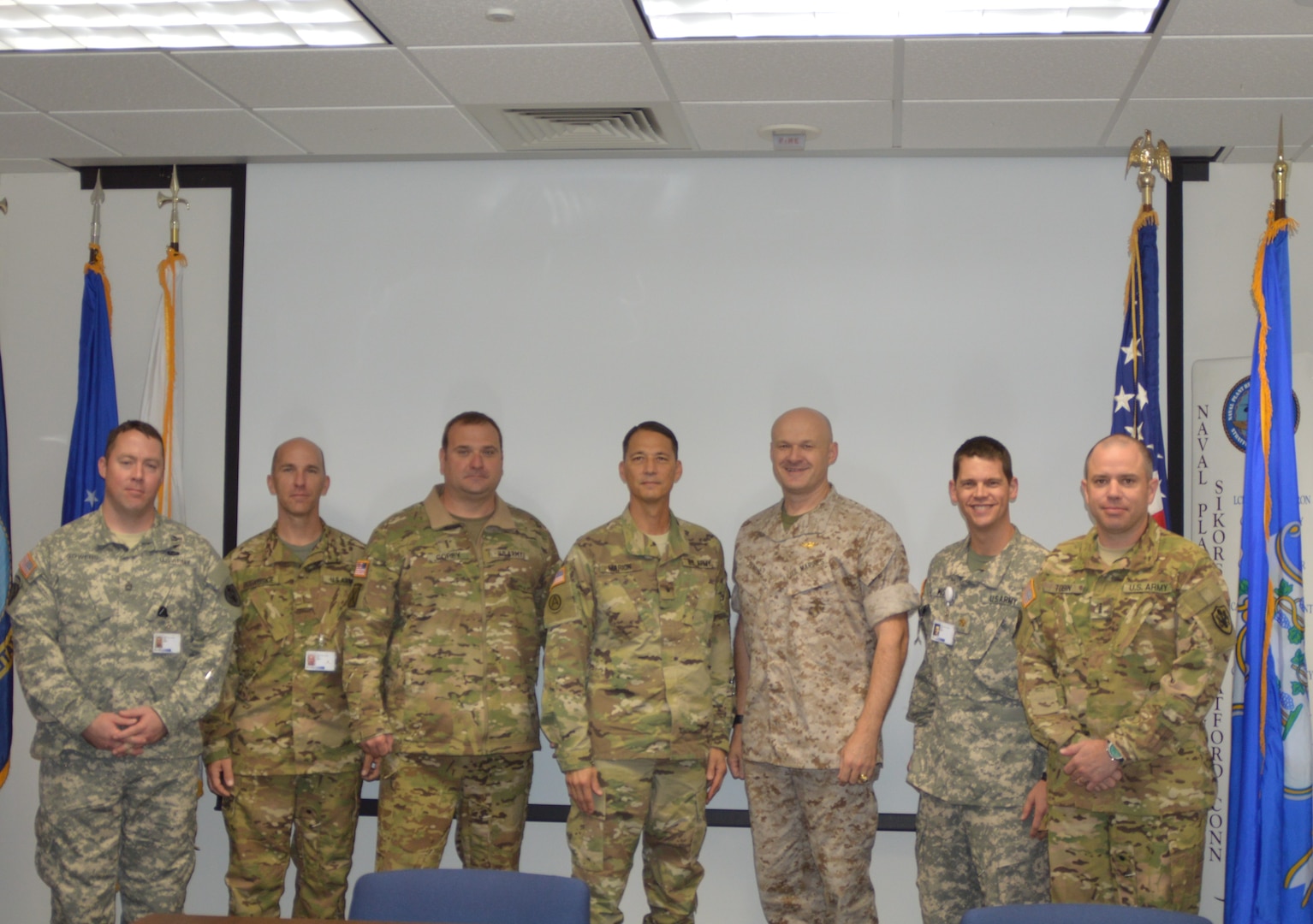 Army Brig. Gen. Robert Marion, program executive officer for Aviation (center), meets with military members of DCMA Sikorsky in Stratford, Connecticut, Oct. 13, during the agency’s ceremony celebrating the 1,000th Black Hawk delivery to the Army. From left to right: Army Sgt. 1st Class William Sowers; Army Chief Warrant Officer 5 Mike Bobkoskie; Army Chief Warrant Officer 4 Vance Corey; Marion; Marine Col. Jack Perrin; Army Maj. Rob Massey; Army Chief Warrant Officer 4 Michael Tobin. (DCMA photo by Steven Kaufman)


