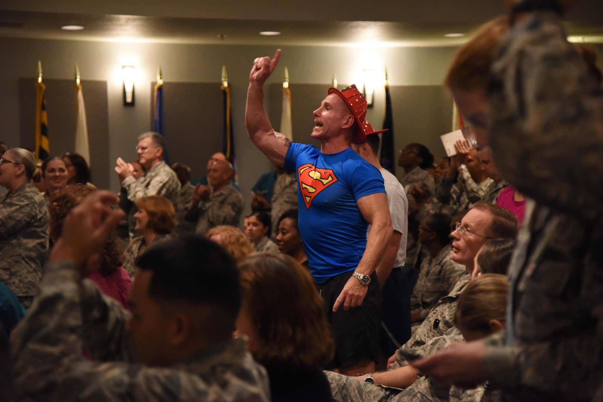 Chief Master Sgt. Karl Day, 81st Medical Group superintendent, shouts out a comment during the 81st MDG Push-up Competition at the Keesler Medical Center Don Wylie Auditorium Nov. 1, 2016, on Keesler Air Force Base, Miss. Seven five-person teams competed in the event pushing out a total of 6,272 push-ups. The 81st Dental Squadron was this year’s winner with 1,127 push-ups. The Airmen who participated in the event raised money to support the Krewe of Medics Mardi Gras Ball. (U.S. Air Force photo by Kemberly Groue/Released)
