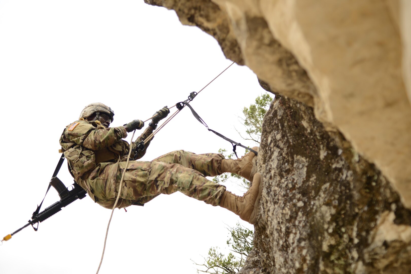 An Army combat medic ascends a cliff as part of the
Best Medic Competition at Joint Base San Antonio-Camp
Bullis Oct. 25. The 72-hour contest forced Army medics
to perform feats of physical and emotional strength as well
as critical thinking in hopes to being named the Army’s
best medics.