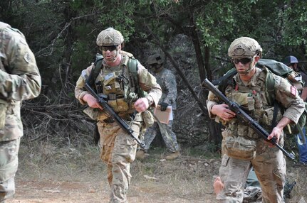 Staff Sgt. Noah Mitchell (left) and Sgt. Derick Bosley (right) negotiate an obstacle Oct. 27 during the 2016 Army Best Medic Competition at Joint Base San Antonio-Fort Sam Houston. The two were named winners of the competition during an awards ceremony Friday. Bosley and Mitchell, both Army Rangers with 3rd Battalion, 75th Ranger Regiment, represented U.S. Army Special Operations Command in the annual event.