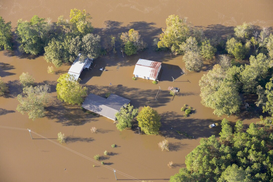North Carolina National Guard UH-60 Blackhawk Helicopters fly over flooded areas of Eastern N.C. after Hurricane Matthew. Guardsmen from across the state are continuing rescue and relief missions with more than 1000 Guardsmen currently activated in the wake of the storm. (U.S. Army National Guard photo by Capt. Michael Wilber)