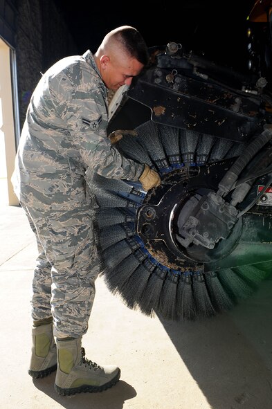 Airman 1st Class Tyler Cecil, 5th Civil Engineer Squadron pavements and equipment apprentice, changes bristles on a snow broom at Minot Air Force Base, N.D., Nov. 1, 2016. From the flight line to the missile fields, snow control is hard at work every day to make sure the mission continues successfully. (U.S. Air Force photo/Senior Airman Kristoffer Kaubisch)