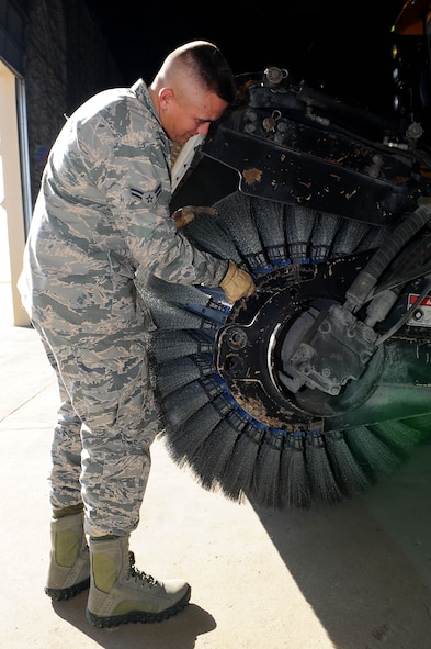 Airman 1st Class Tyler Cecil, 5th Civil Engineer Squadron pavements and equipment apprentice, changes bristles on a snow broom at Minot Air Force Base, N.D., Nov. 1, 2016. From the flight line to the missile fields, snow control is hard at work every day to make sure the mission continues successfully. (U.S. Air Force photo/Senior Airman Kristoffer Kaubisch)