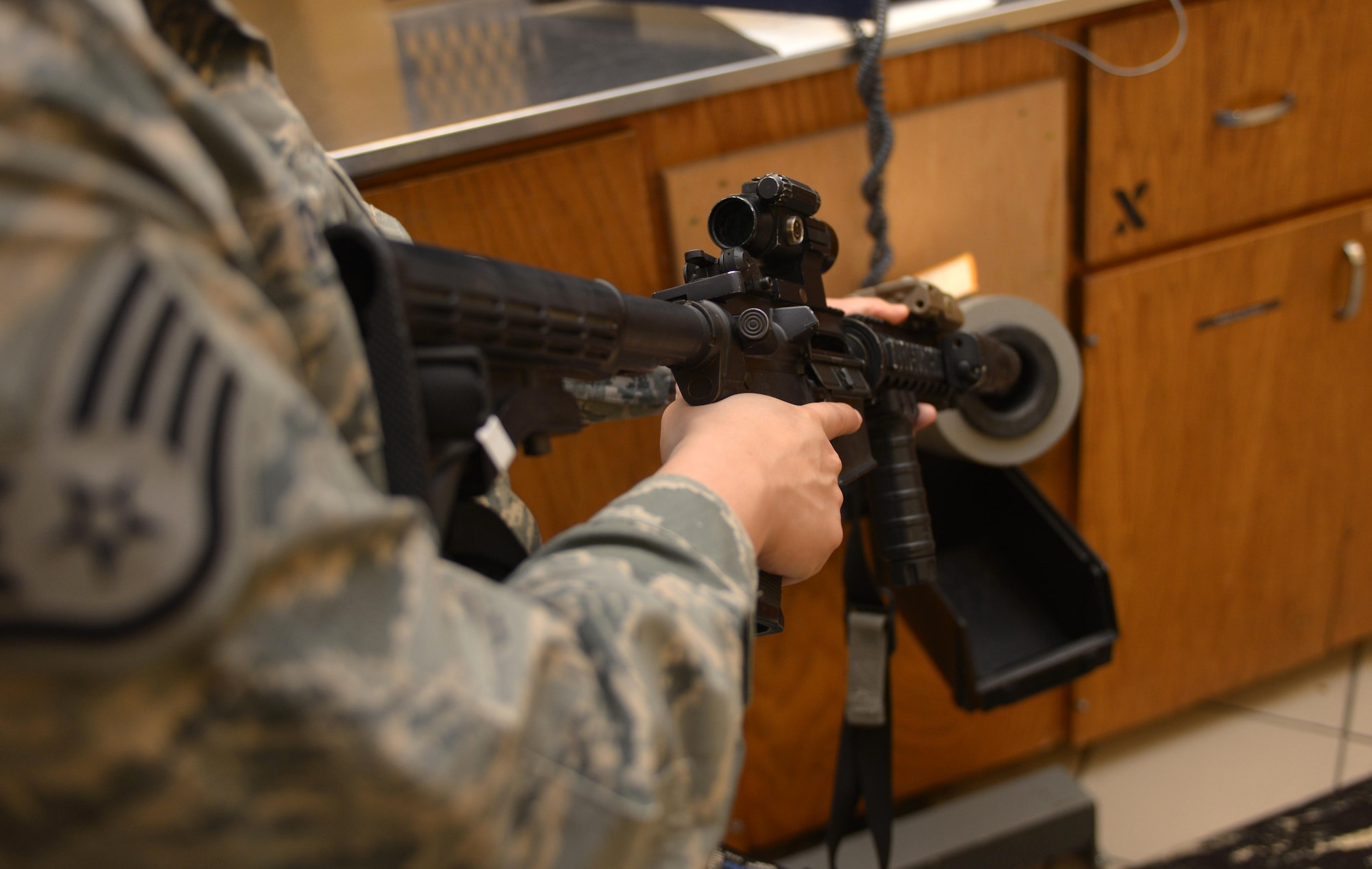 Staff Sergeant Elizabeth Gregson, the armory non-commissioned officer in charge assigned to the 28th Security Forces Squadron, clears an M4 carbine rifle in the armory at Ellsworth AFB, S.D., Oct. 26, 2016. Aside from issuing and accepting gear, armorers must account for every piece of equipment each day to ensure it is all accounted for and in safe hands. (U.S. Air Force photo by Airman 1st Class Donald Knechtel)