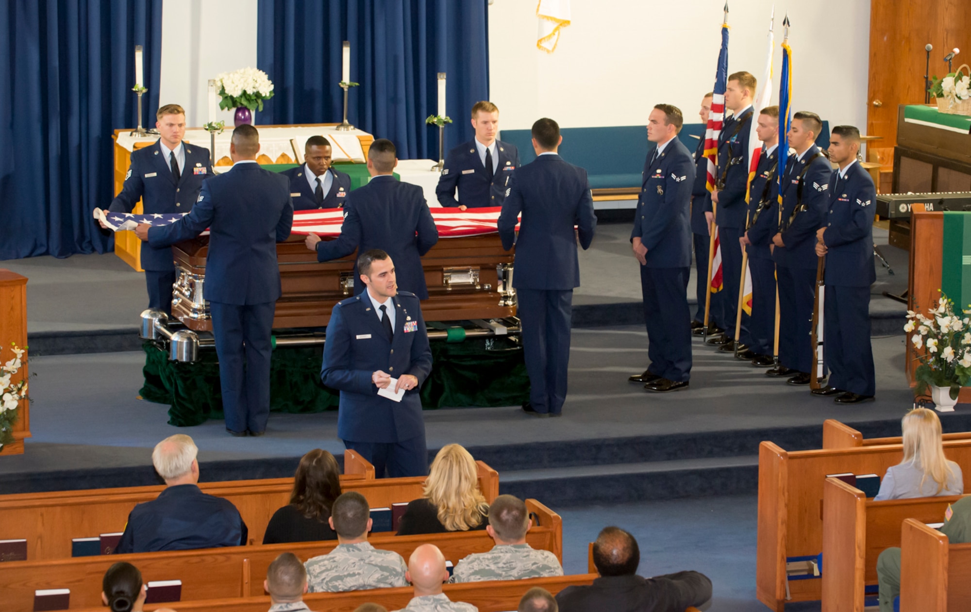 The newest members of the Blue Eagles Honor Guard perform a mock funeral Oct. 28 at Chapel 1 in front of an audience. The funeral is part of the class' graduation day. (U.S. Air Force photo by Brad White)