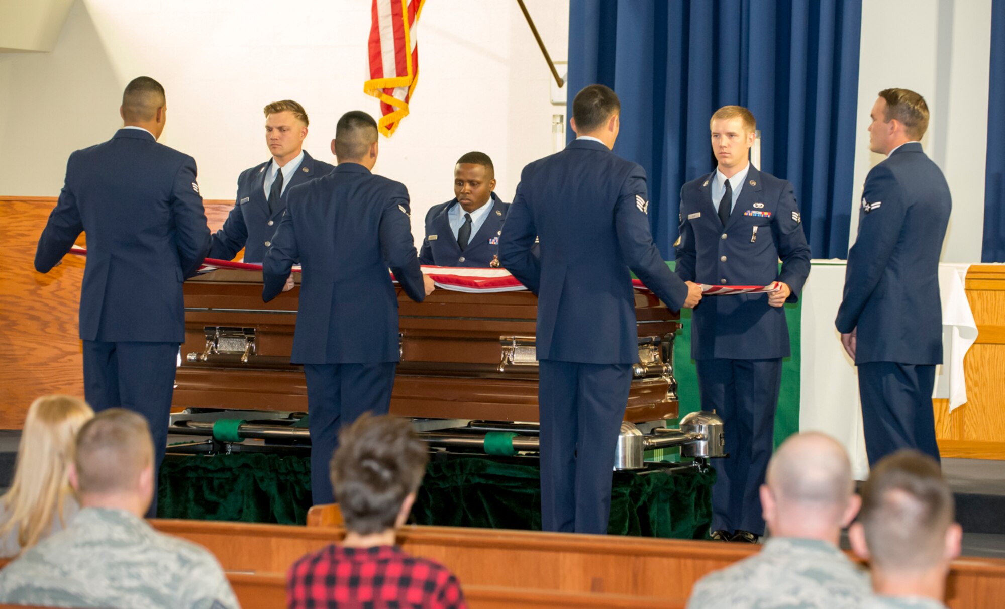 The newest members of the Blue Eagles Honor Guard perform a mock funeral Oct. 28 at Chapel 1 in front of an audience. The funeral is part of the class' graduation day. (U.S. Air Force photo by Brad White)