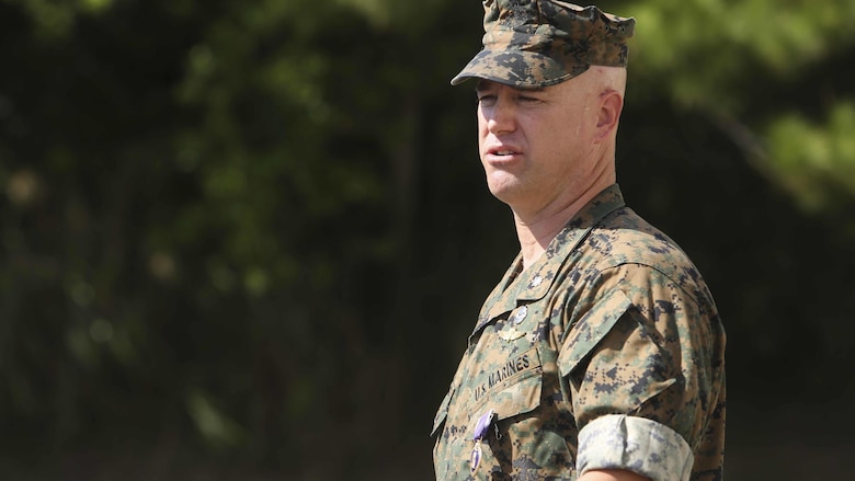 Lt. Col. Robert C. Sellers, 3rd Marine Expeditionary Brigade Assistant Chief of Staff G-4, addresses friends and family at his Purple Heart award ceremony in front of Secher Hall on Camp Hansen, Okinawa, Japan, October 28, 2016. The ceremony was held in front of Secher Hall to remind those in attendance to remember the fallen.