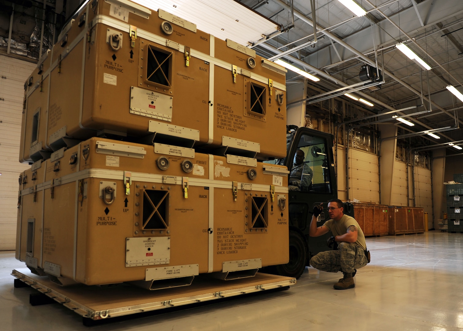 Staff Sgt. Joel Miller, 27th Special Operations Logistics Readiness Squadron Materiel Management flight Mobility Readiness Spare Package supervisor, directs Senior Airman Lawrence Wright 27th SOLRS Materiel Management flight MRSP journeyman, as he palletizes parts at Cannon Air Force Base, N.M., October 19, 2016. MRSPs contain spare parts for aircraft and are used to support designated weapons systems for as many as 30 consecutive days downrange. (U.S. Air Force photo/Staff Sgt. Whitney Amstutz/released)