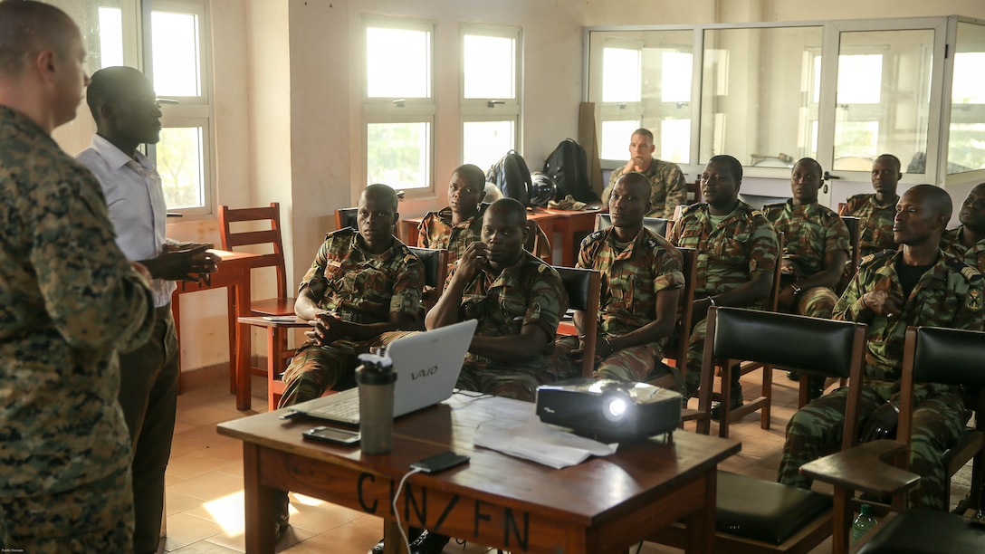 Sgt. Mateusz Kaczynski, a maintenance management chief with Special Purpose Marine Air-Ground Task Force Crisis Response-Africa, addresses a class of non-commissioned officers from the Benin Navy at Benin Naval Forces Headquarters, Cotonou, Benin, October 24, 2016. The U.S. Marine Corps theater security cooperation team with SPMAGTF-CR-AF spent two weeks teaching an NCO development and maintenance management course during their time training with the Benin Navy.  