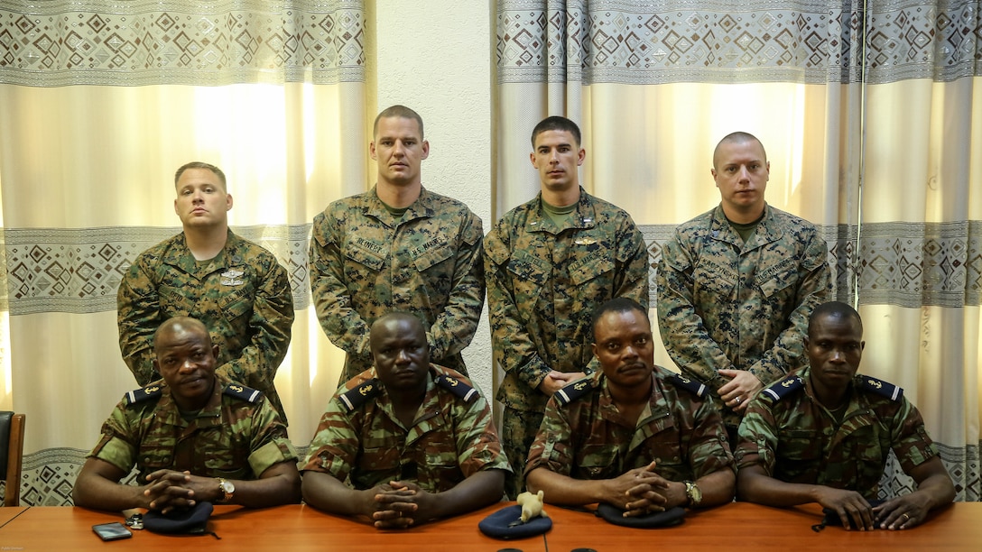 Marines with with Special Purpose Marine Air-Ground Task Force Crisis Response-Africa pose for a photo with the senior leaders of the graduating class at Benin Naval Forces Headquarters, Cotonou, Benin, October 28, 2016. The U.S. Marine Corps theater security cooperation team with SPMAGTF-CR-AF spent two weeks teaching an NCO development and maintenance management course during their time training with the Benin Navy.  