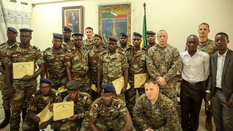 Sailors from the Benin Navy and Marines with Special Purpose Marine Air-Ground Task Force Crisis Response-Africa pose for a group photo following a graduation ceremony at Benin Naval Forces Headquarters, Cotonou, Benin, October 28, 2016. The U.S. Marine Corps theater security cooperation team with Special Purpose Marine Air-Ground Task Force Crisis Response-Africa spent two weeks teaching an NCO development and maintenance management course during their time training with the Benin Navy.  