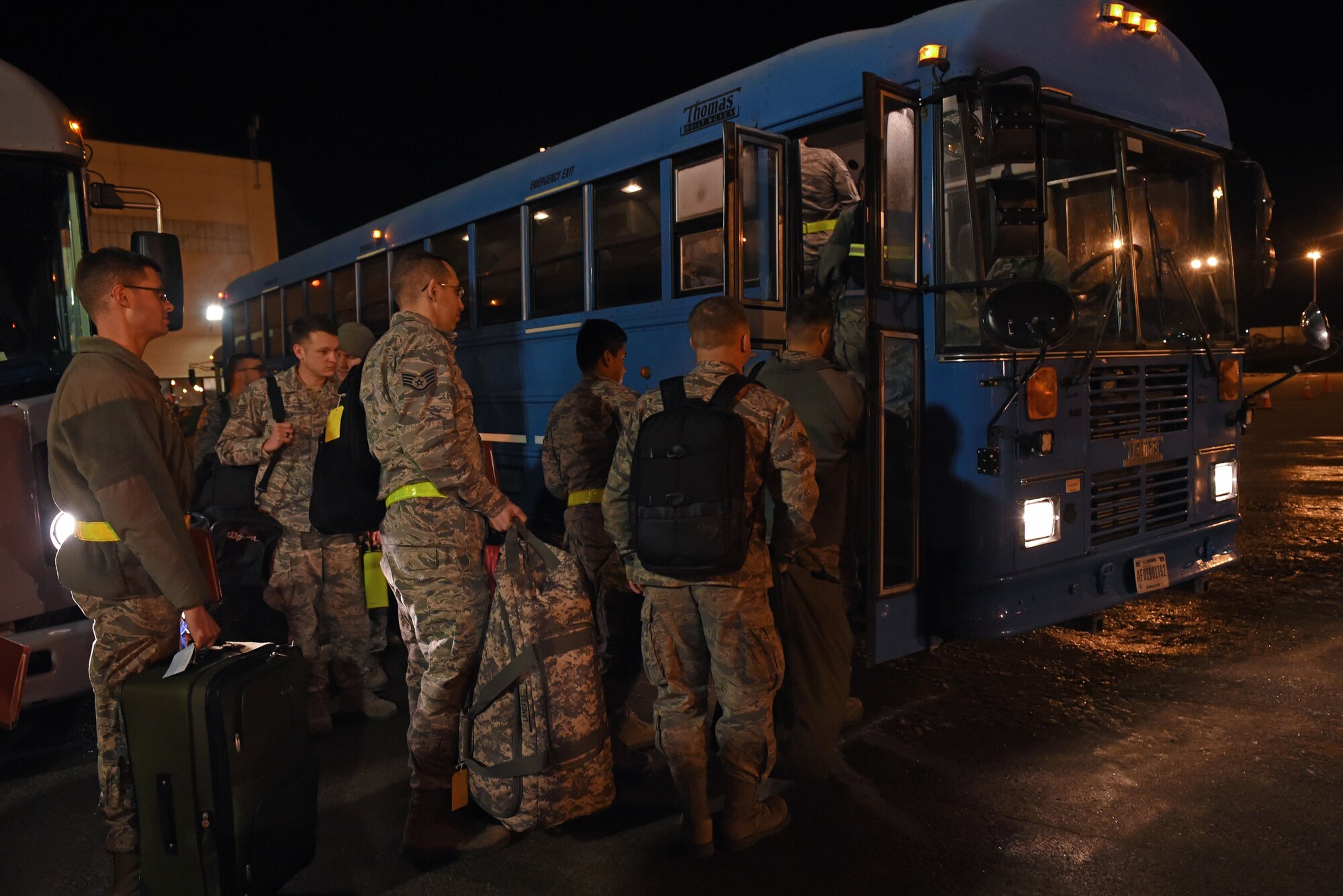 Joint Base Elmendorf-Richardson Airmen board buses as part of a mock-deployment during exercise Polar Force 17-1 at the Joint Mobility Center, Nov. 2, 2016. Regular operational exercises, like Polar Force 17-1, ensure maximum readiness to deploy across the installation. 
