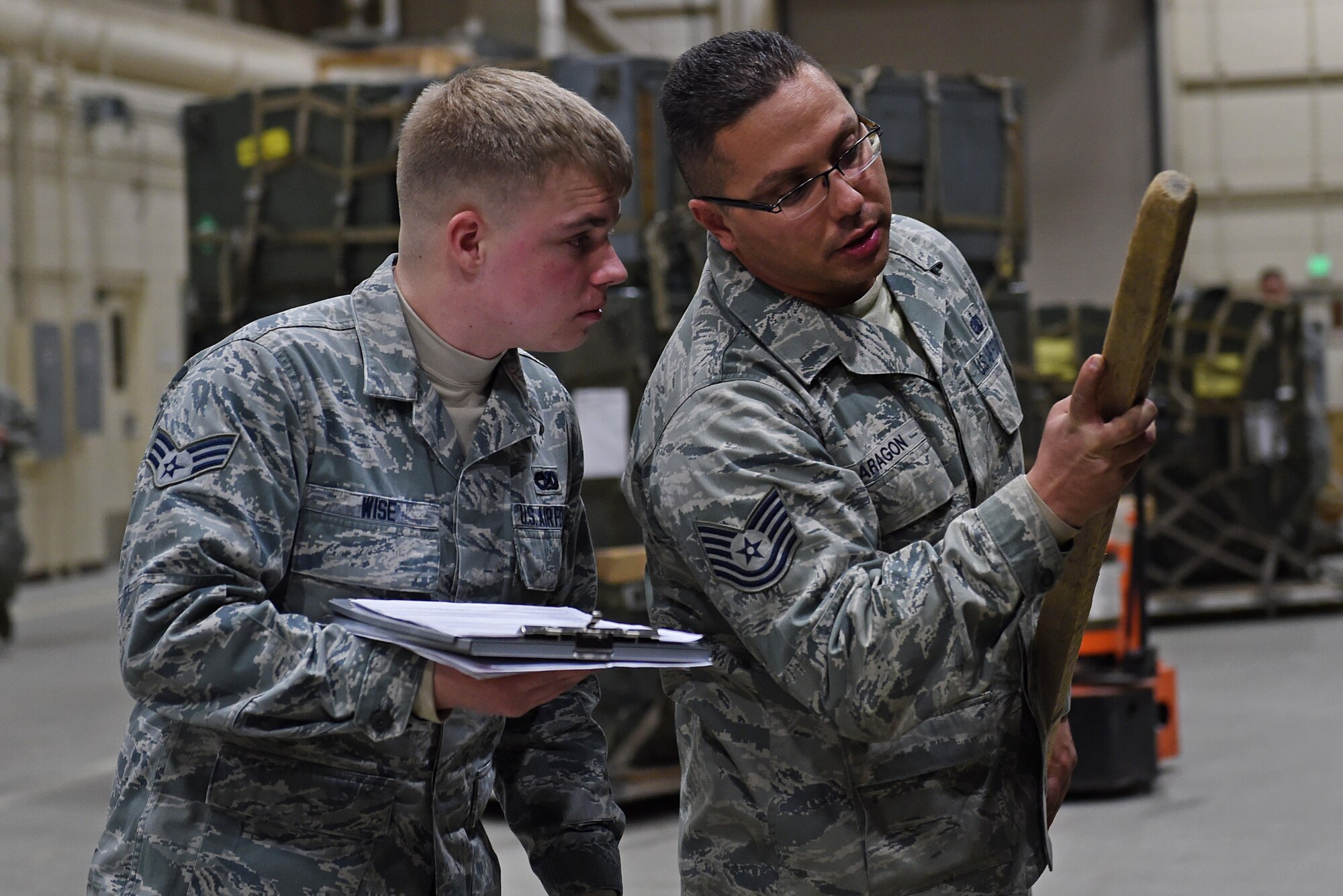 Senior Airman Brandon Wise, left, and Tech. Sgt. Ronald Aragon, right, take measurements of a fuel truck during exercise Polar Force 17-1 at the Joint Mobility Center, Nov. 2, 2016. Wise is a passenger service agent with the 732nd Air Mobility Squadron and Aragon is the NCO in charge of training support with the 673d Logistics Readiness Squadron. 