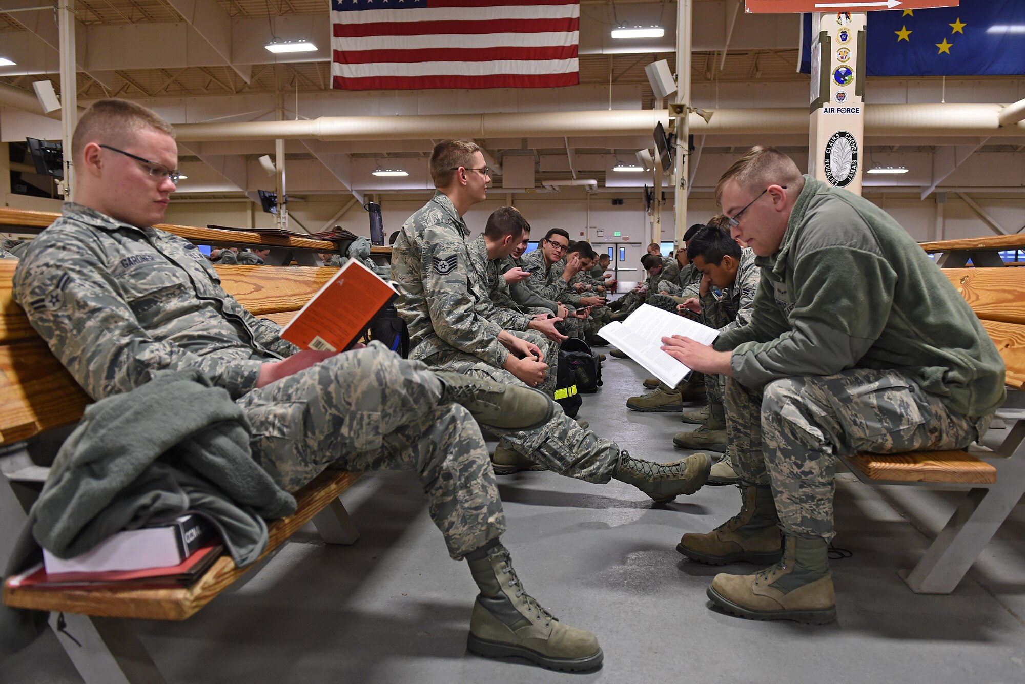 Joint Base Elmendorf-Richardson Airmen wait to participate in mock-deployment preparation during exercise Polar Force 17-1 at the Joint Mobility Center, Nov. 2, 2016. During the simulated exercise, Airmen moved through a process line to ensure their ability to deploy and were briefed by multiple agencies with vital information for their deployment. (U.S. Air Force photo by Airman 1st Class Javier Alvarez)