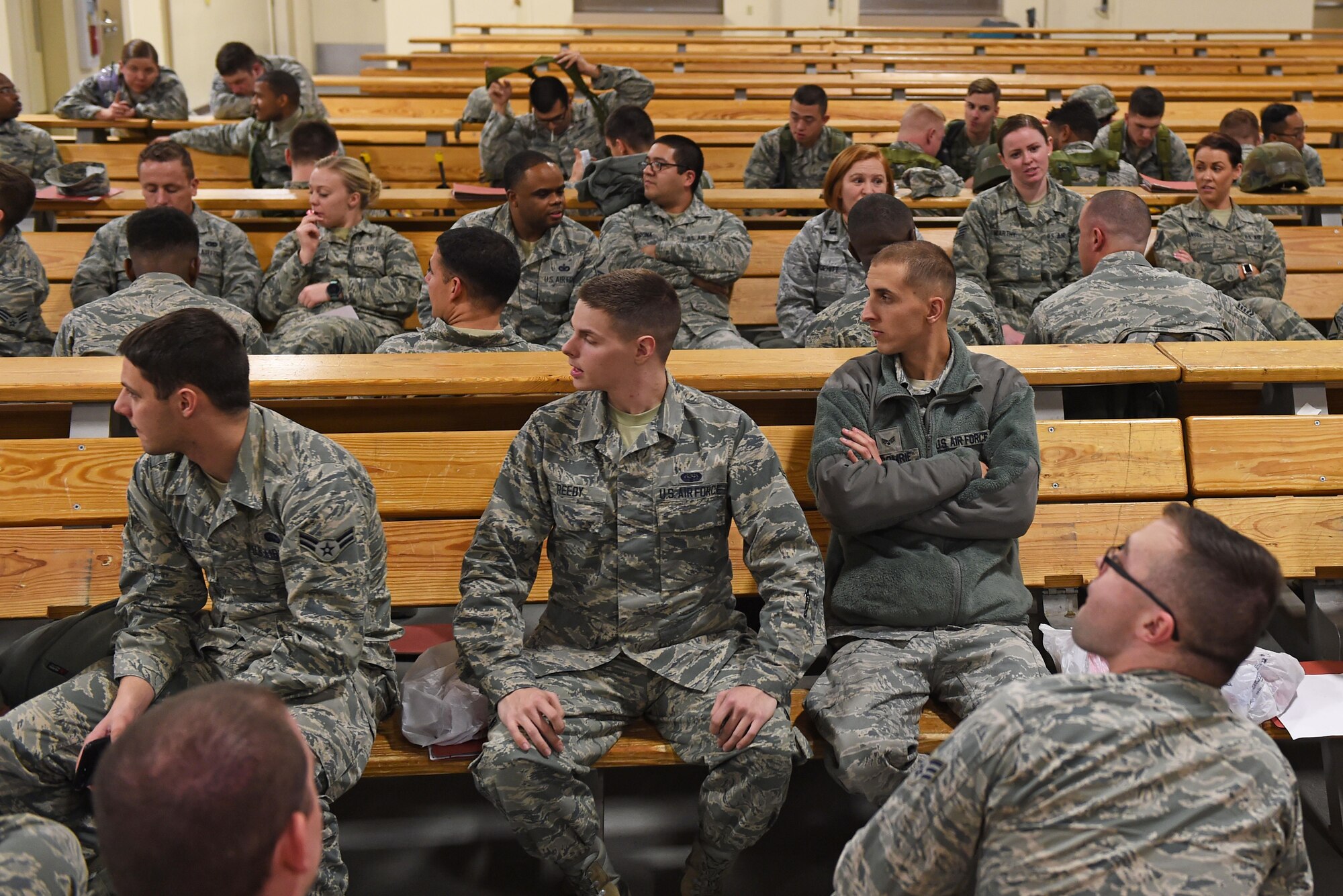 Joint Base Elmendorf-Richardson Airmen wait to participate in mock-deployment preparation during exercise Polar Force 17-1 at the Joint Mobility Center, Nov. 2, 2016. During the simulated exercise, Airmen moved through a process line to ensure their ability to deploy and were briefed by multiple agencies with vital information for their deployment. 