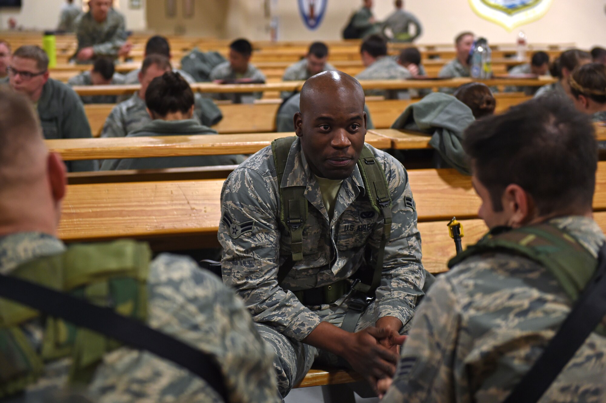 Airman 1st Class Darrick Jones with 773d Civil Engineer Squadron, waits to take part in a simulated Personnel Deployment Function line before a mock-deployment as part of exercise Polar Force 17-1 at the Joint Mobility Center, Nov. 2, 2016. During the simulated exercise, Airmen moved through a process line to ensure their ability to deploy and were briefed by multiple agencies with vital information for their deployment. 