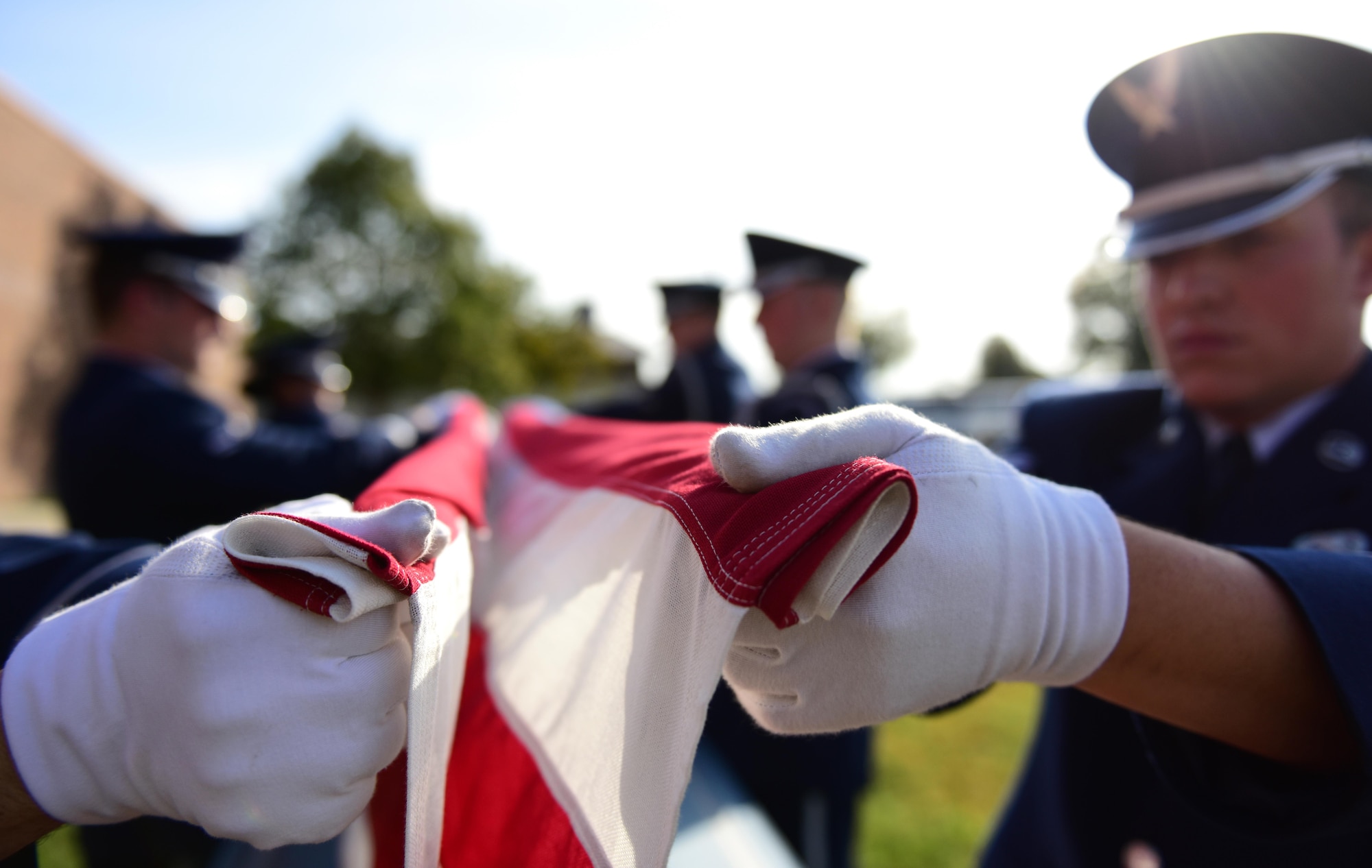 Members of the Whiteman Air Force Base Honor Guard hold an American flag at the “canoe” position during a simulated funeral at Whiteman Air Force Base, Mo., Nov. 2, 2016. Made up of members from different units throughout the base, the Whiteman Honor Guard performs funeral and military honors in support of 99 counties in Missouri and 19 counties in Kansas, covering more than 70,000 square miles, one of the biggest areas of responsibility in all of Air Force Global Strike Command. (U.S. Air Force photo by Senior Airman Joel Pfiester)