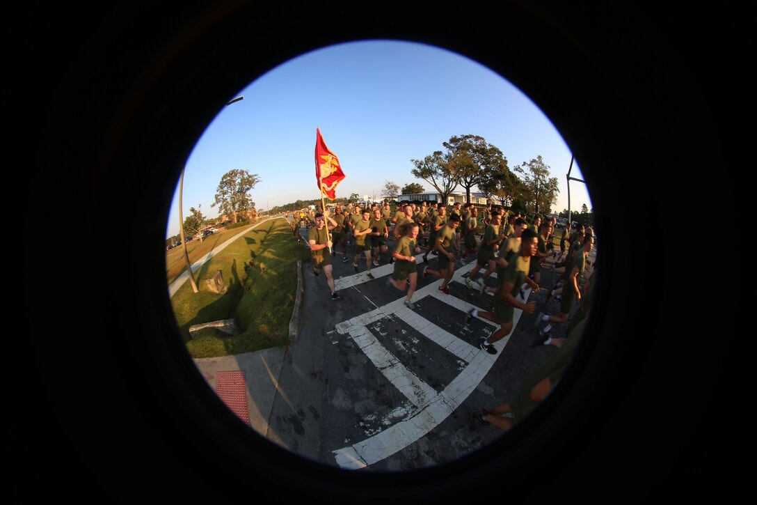 Thousands of Marines and Sailors run through the streets during a Marine Corps birthday run at Marine Corps Air Station Cherry Point, N.C., Nov. 3, 2016. The run celebrated the 241st Marine Corps birthday and strengthened pride, esprit de corps, and camaraderie among all Marines and Sailors aboard the air station. (U.S. Marine Corps photo by Sgt. N.W. Huertas/Released)