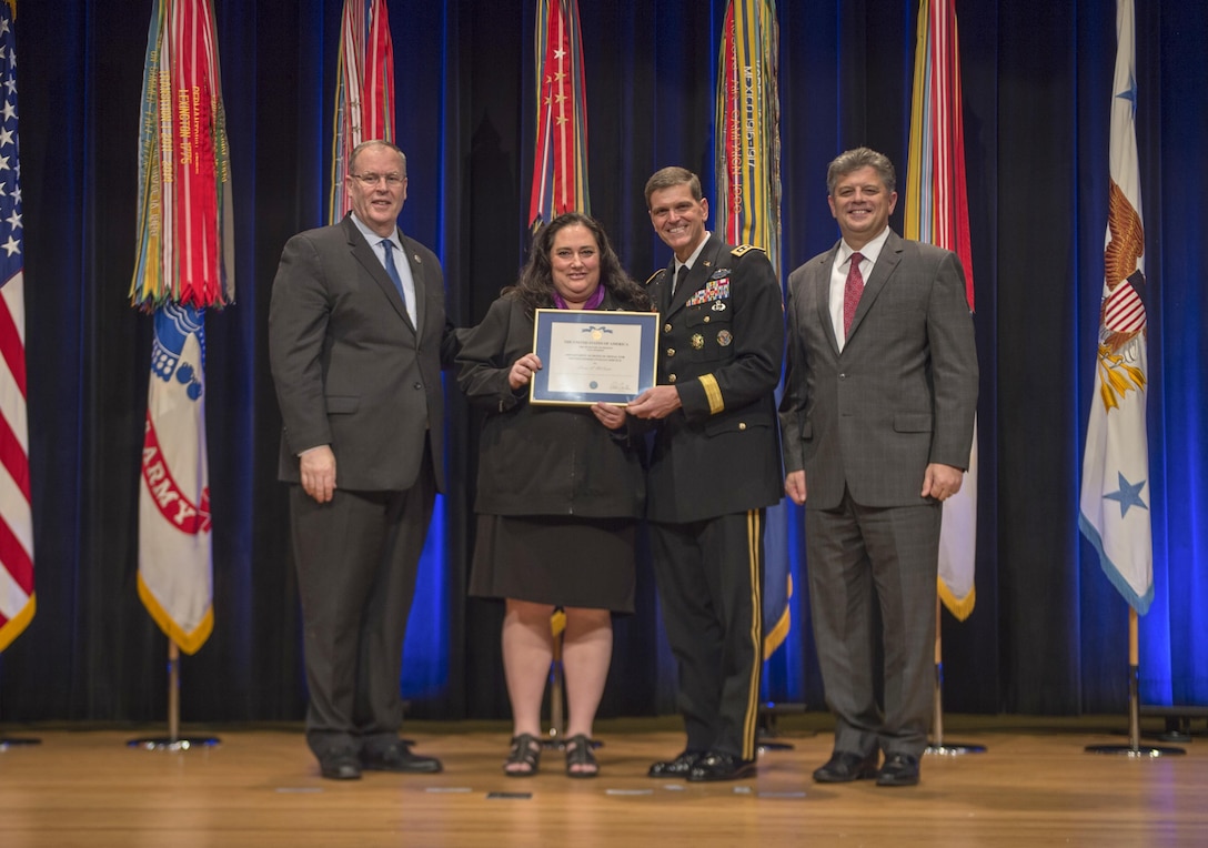 Deputy Secretary of Defense Bob Work awards Elaine McCusker, U.S. Central Command, the Department of Defense Distinguished Civilian Service Award during the 61st Annual DOD Distinguished Civilian Service Awards Nov. 3, 2016, at the Pentagon in Washington, D.C. (DoD photo by Air Force Tech. Sgt. Brigitte N. Brantley)