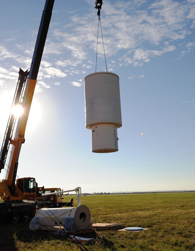 A crane removes an old Tactical Air Navigation system at Dyess Air Force Base, Texas, Oct. 18, 2016. The installment of the new TACAN system is part of an Air Force-wide TACAN replacement program. (U.S. Air Force photo by Airman 1st Class April Lancto)