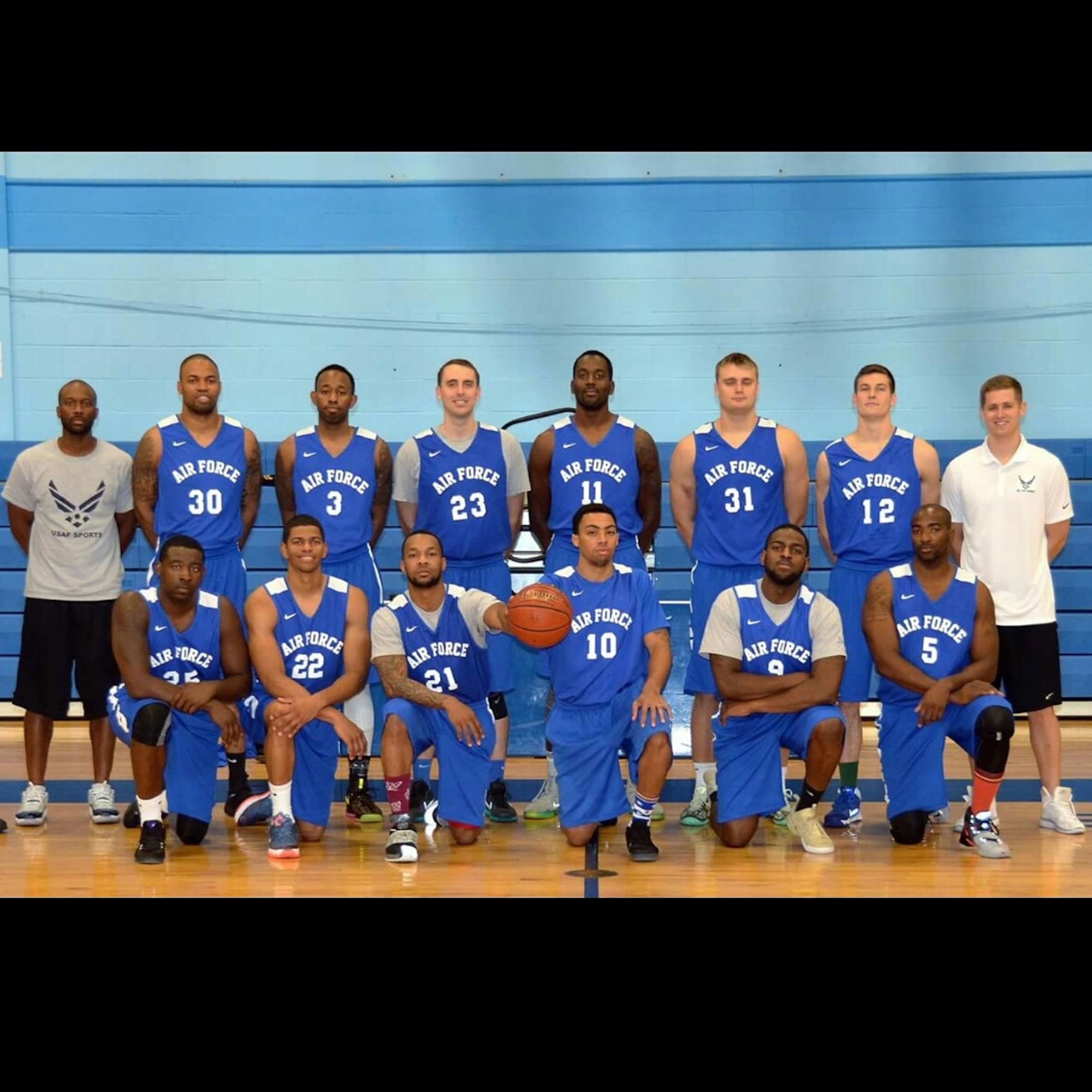 Staff Sgt. Brian Washington, an Airman dormitory leader with the 1st Special Operations Civil Engineer Squadron, fifth from the left on bottom row, poses for a group photo along with teammates. The All-Air Force Men’s Basketball team is competing in the Armed Forces Tournament through Nov. 8. (Courtesy Photo)