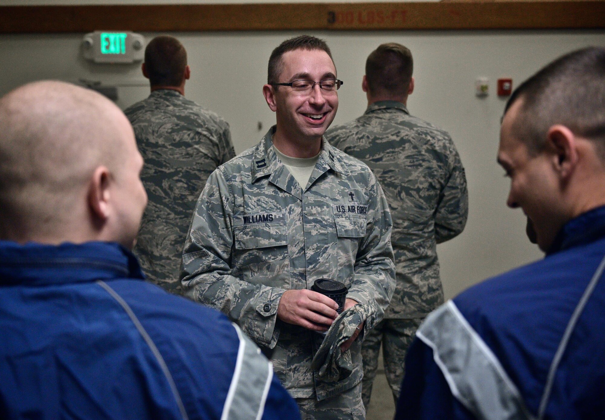 Chaplain (Capt.) Mike Williams, 932nd Airlift Wing, shares a laugh with 932nd AW Security Forces members during the SFS morning briefing, Oct. 1, 2016, Scott Air Force Base, Illinois.  932nd chaplains and chaplain assistants, referred to as Religious Support
Teams (RST), have the privilege of focusing on caring for unit members and
their families throughout the deployment cycle.  Unit visits and personal engagements are a part of this warrior care.  "The 932nd AW Religious Support Teams provide proactive pastoral care as
well as religious accommodations that meet diverse spiritual needs, in order to foster the spiritual pillar of Comprehensive Airman Fitness within the Wing," said Chaplain (Lt. Col.) William Thornton.  (U.S. Air Force photo by Tech. Sgt. Christopher Parr)