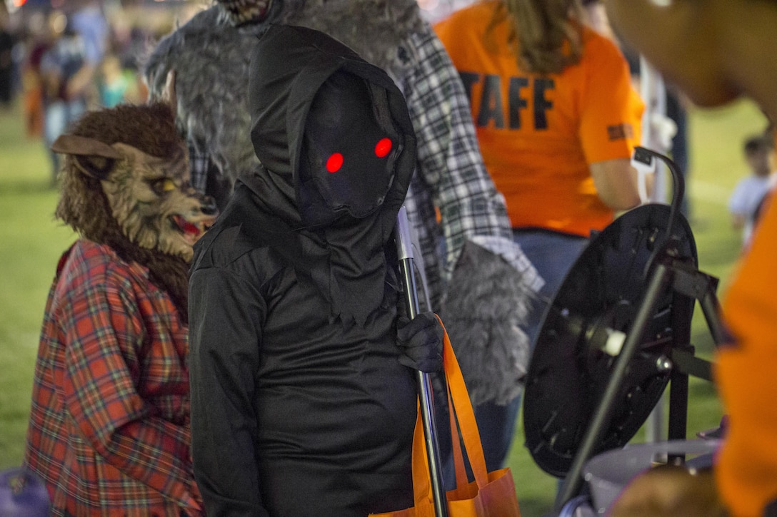 Combat Center children trick-or-treat and enjoy carnival games at the Jack-O-Lantern Jubilee hosted by Marine Corps Community Services at Del Valle Field aboard the Marine Corps Air Ground Combat Center, Twentynine Palms, Calif., Oct. 28, 2016. (Official Marine Corps photo by Cpl. Levi Schultz/Released)