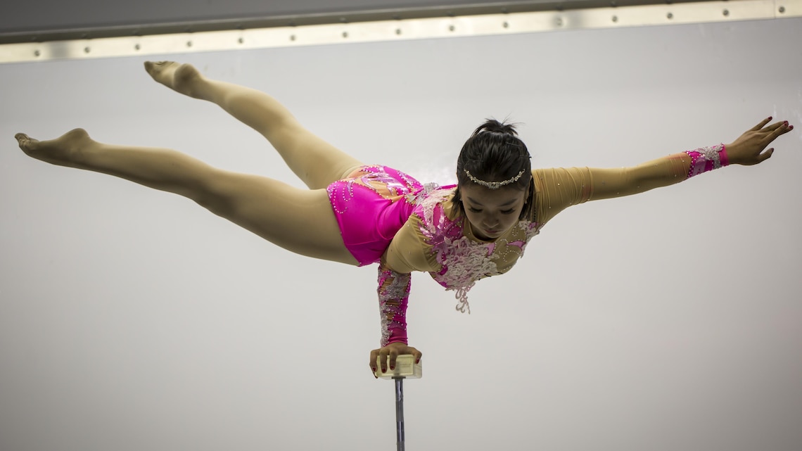 An acrobat with EM Cirque performs at the Jack-O-Lantern Jubilee hosted by Marine Corps Community Services at Del Valle Field aboard the Marine Corps Air Ground Combat Center, Twentynine Palms, Calif., Oct. 28, 2016. (Official Marine Corps photo by Cpl. Levi Schultz/Released)