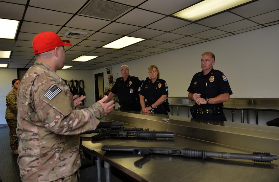 Staff Sgt. Casey Paine, NCO in charge of Combat Arms Training and Maintenance, gives a weapons demonstration during a tour at Hurlburt Field, Fla., Nov. 1, 2016. This unit ensures Air Commandos are trained, qualified and certified on weapon systems. (U.S. Air Force photo by Senior Airman Andrea Posey)