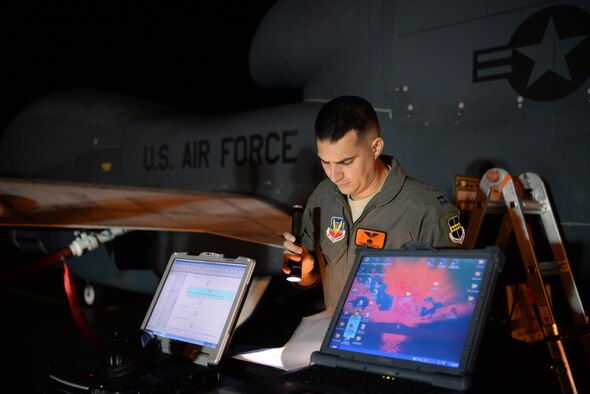 Capt. Thomas, a12th Reconnaissance Squadron RQ-4 Global Hawk pilot, reviews a preflight checklist Nov. 1, 2016, at Beale Air Force Base, Calif. Thomas fulfilled the role of “Hawkeye,” which is the call sign for the designated RQ-4 pilot who performs preflight inspections on RQ-4s prior to flight. (U.S. Air Force photo/Staff Sgt. Bobby Cummings)