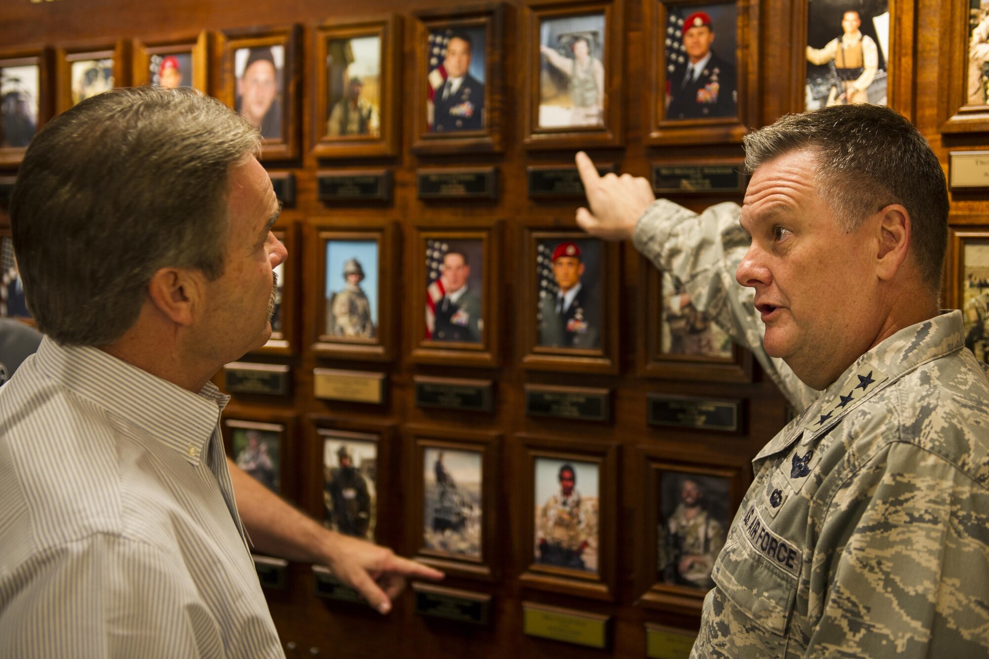 Lt. Gen. Brad Webb, commander of Air Force Special Operations Command, briefs Stacey Martin, an Air Force Chief of Staff civic leader from Clovis, N.M., on the history of the Air Force Cross and Silver Star Medal recipients at Hurlburt Field, Fla., Nov. 2, 2016. Civic leaders are unpaid advisors, key communicators and advocates for the Air Force. (U.S. Air Force photo by Airman 1st Class Joseph Pick)