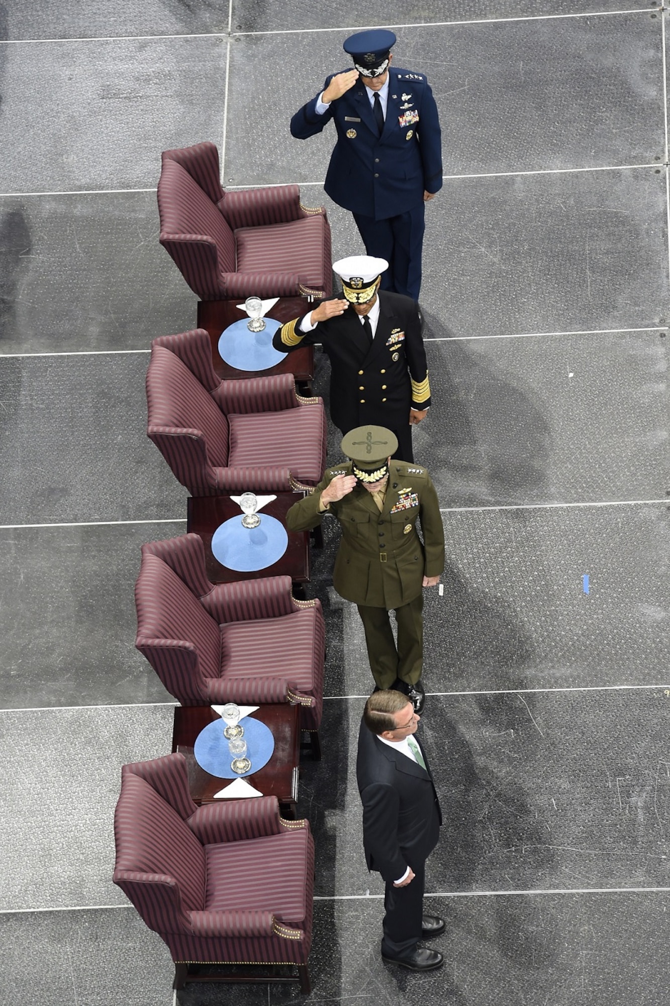 From top to bottom, Gen. John E. Hyten, U.S. Strategic Command (USSTRATCOM) commander; Adm. Cecil D. Haney, former USSTRATCOM commander; and Gen. Joseph Dunford, Chairman of the Joint Chiefs of Staff, salute Secretary of Defense Ash Carter at USSTRATCOM’s change of command ceremony at Offutt Air Force Base, Neb., Nov. 3, 2016. Carter presided over the change of command and provided remarks during which he thanked Adm. Cecil D. Haney, outgoing USSTRATCOM commander, for his service. He also congratulated Gen. John E. Hyten on his appointment as the new USSTRATCOM commander. Additionally, Chairman of the Joint Chiefs of Staff Gen. Joseph F. Dunford provided remarks during the ceremony and presented the Joint Meritorious Unit Award to USSTRATCOM. Hyten previously served as commander of Air Force Space Command, and Haney will retire from active military duty during a separate ceremony in January. One of nine DoD unified combatant commands, USSTRATCOM has global strategic missions assigned through the Unified Command Plan that include strategic deterrence; space operations; cyberspace operations; joint electronic warfare; global strike; missile defense; intelligence, surveillance and reconnaissance; combating weapons of mass destruction; and analysis and targeting. (U.S. Navy photo by Petty Officer 1st Class Byron C. Linder)