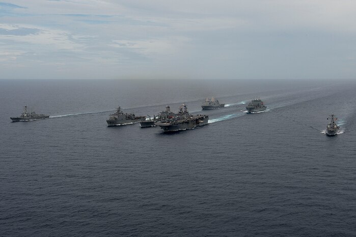 From left, the guided-missile destroyer USS Spruance (DDG 111), the amphibious dock landing ship USS Germantown (LSD 42), the Military Sealift Command (MSC) fleet oiler USNS Walter S. Diehl (T-AO 193), the amphibious assault ship USS Bonhomme Richard (LHD 6), the amphibious transport dock ship USS Green Bay, the MSC ammunition and cargo ship USNS Washington Chambers (T-AKE 11) and the guided-missile destroyer USS Decatur (DDG 73) steam in formation as part of interoperability drills between the Pacific Surface Action Group (PAC SAG) and Bonhomme Richard Expeditionary Strike Group (BHR ESG) in the South China Sea, Oct. 13, 2016. The drills are meant to enhance readiness of cruiser-destroyer ships to rapidly integrate with an amphibious task force to provide increased capability for amphibious operations in support of crisis response or disaster relief. 
