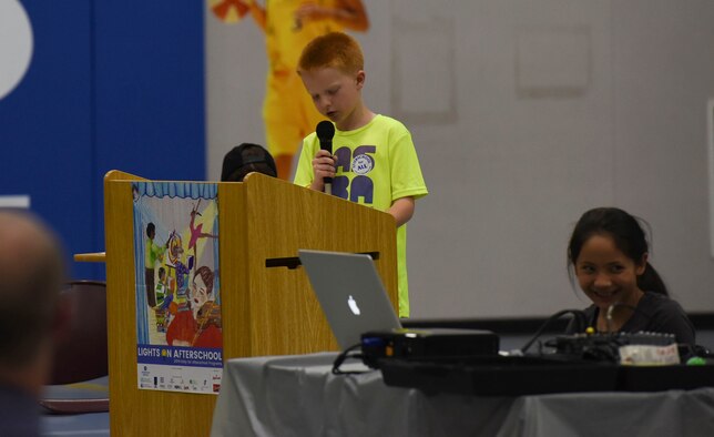 A student speaks at the Lights on Afterschool open house event, October 26, 2016 at Mountain Home Air Force Base, Idaho. The students helped make the event possible by preparing snacks, decorating the facility and making invitations. (U.S. Air Force photo by Airman 1st Class Alaysia Berry/Released)