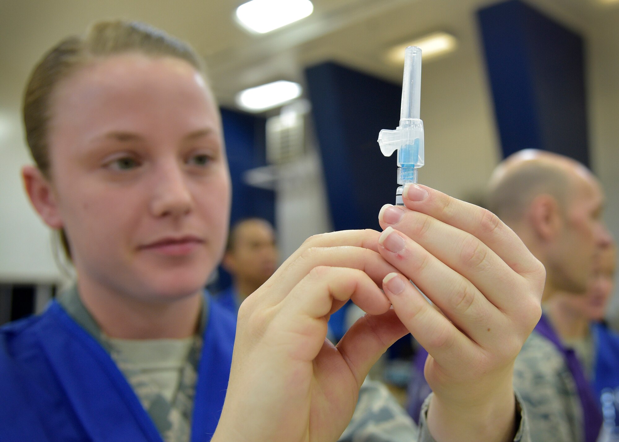 U.S. Air Force Senior Airman Ann Keyser, a bioenvironmental engineer with the 35th Aerospace Medicine Squadron, prepares a flu vaccine during the point of distribution, at Misawa Air Base, Japan, Nov. 3, 2016. This was the first time family members attended a flu line, which tested 35th Medical Group member’s readiness for all personnel on base. Medical experts also administered vaccines for 36 consecutive hours to account for all schedules Team Misawa members may have. (U.S. Air Force photo by Senior Airman Deana Heitzman)