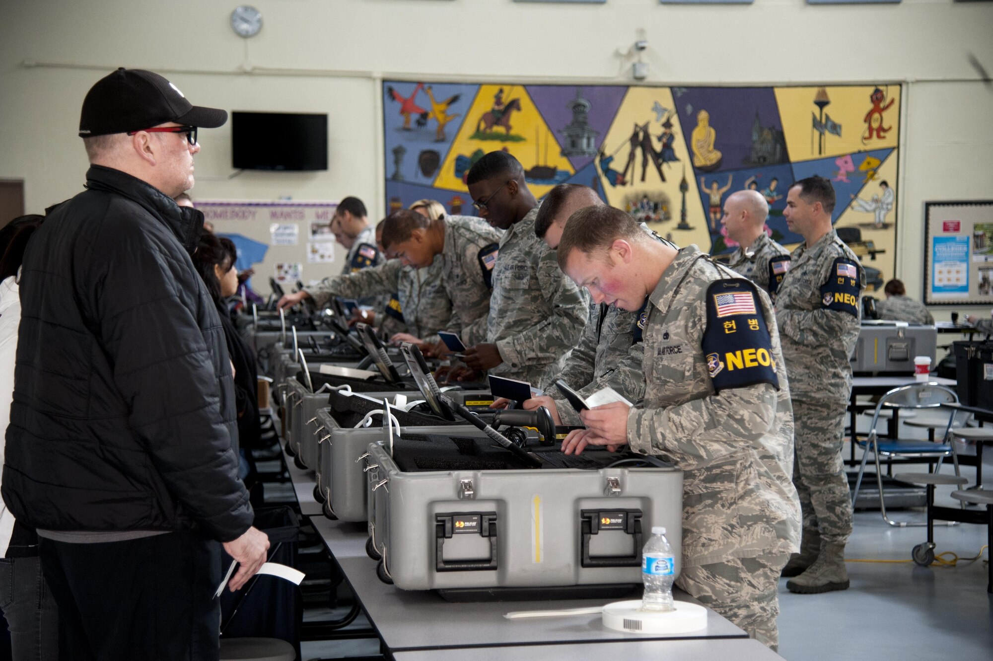 Team Osan Non-combatant Evacuation Operations wardens enter personal data into the Noncombatant Tracking System during exercise Courageous Channel 2016 at Osan Air Base, Republic of Korea, Oct. 29, 2016.  The tracking system ensures the accurate tracking and continuity of evacuees through the process of being moved off the peninsula. (U.S. Air Force photo by Staff Sgt. Jonathan Steffen)  